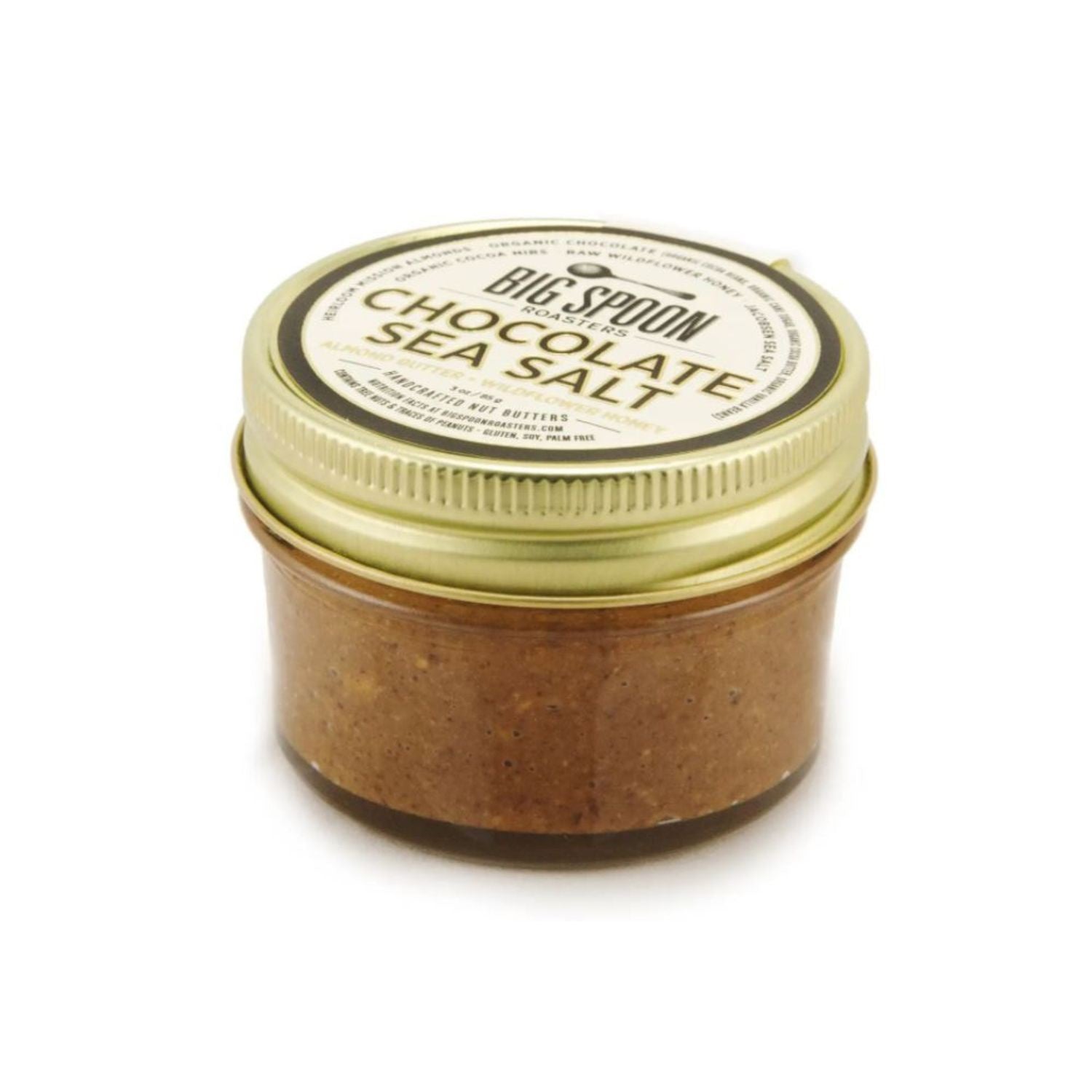 Jar of chocolate sea salt with a gold lid on a white background.