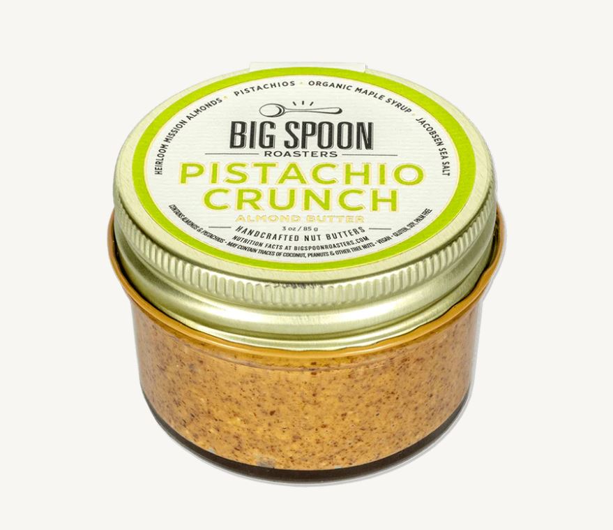 Jar of Big Spoon Roasters Pistachio Crunch on a white background.