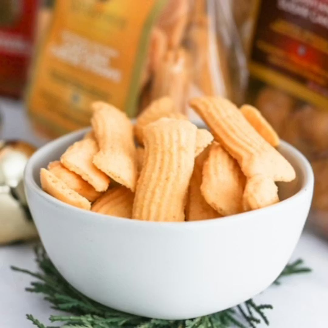 White Bowl of chips with snack bags in the background.