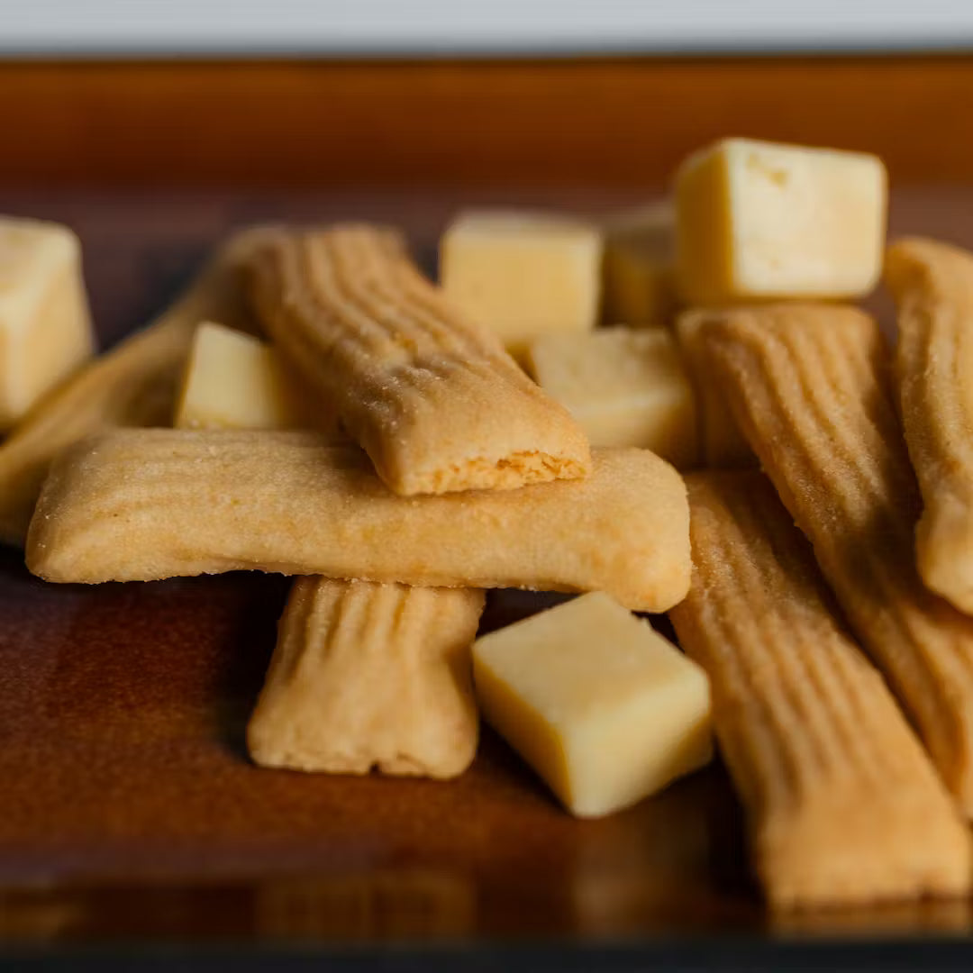 Stack of rectangular cookies on a wooden surface