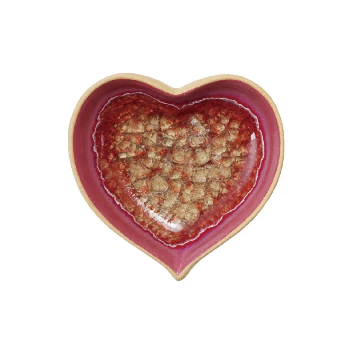 Heart-shaped ceramic dish with a red interior and beige exterior on a white background