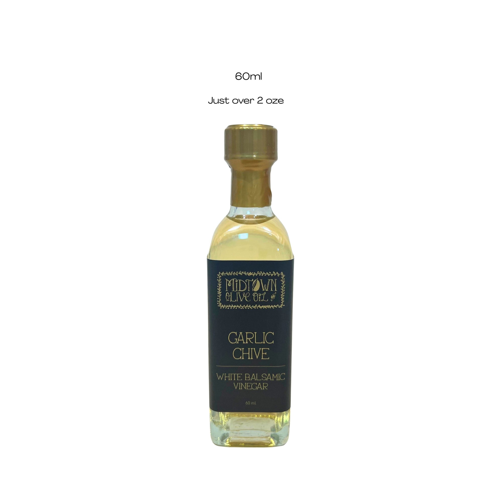 Bottle of Garlic Chive White Balsamic Vinegar with a gold cap on a white background