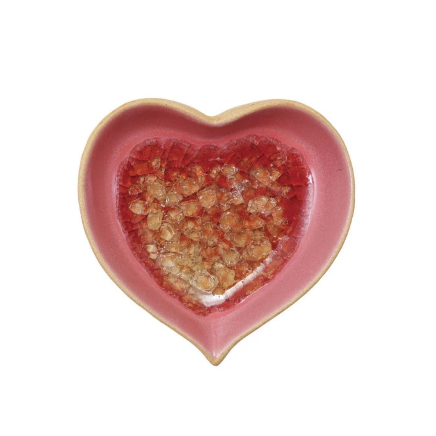 Heart-shaped pink ceramic dish with a textured red interior on a white background