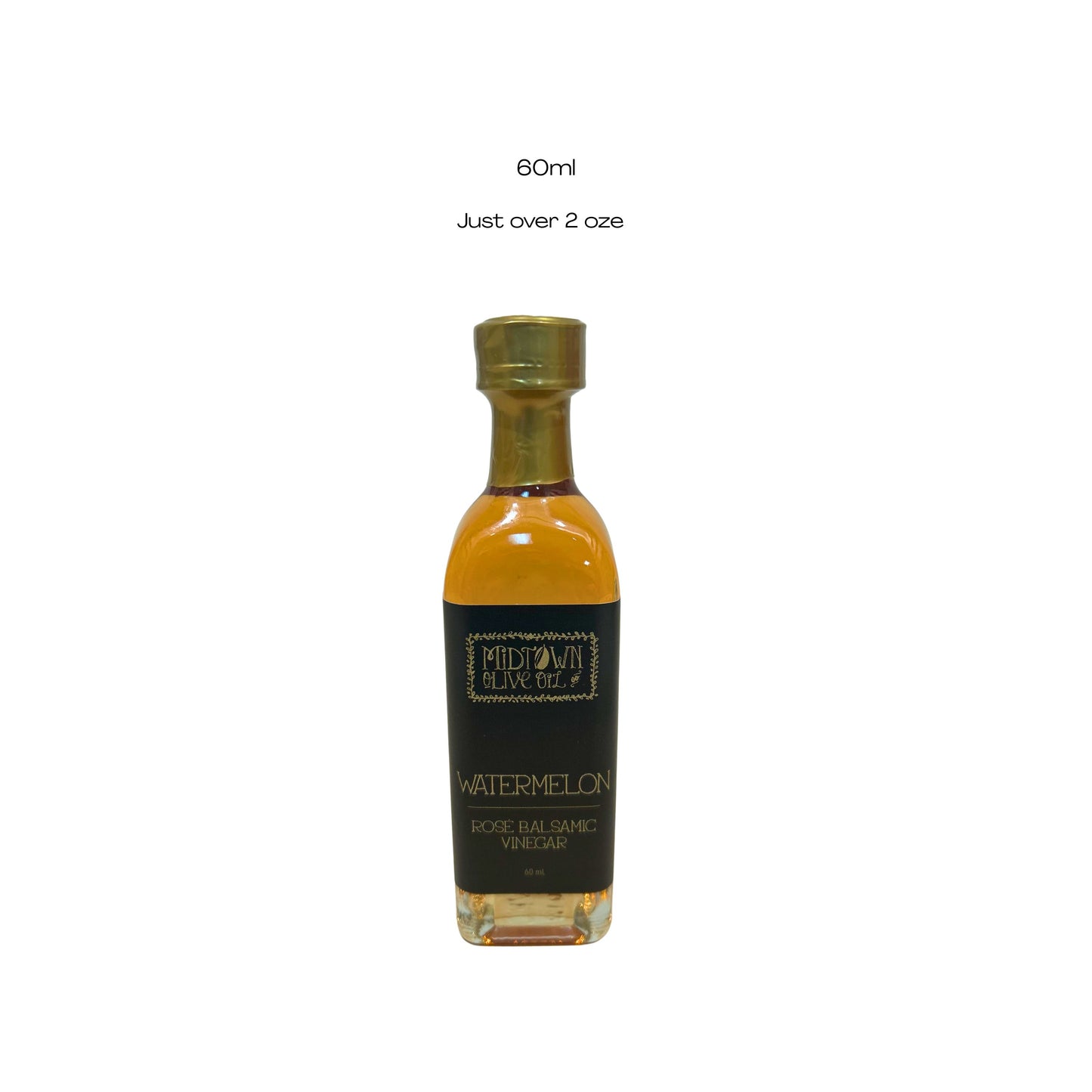 Bottle of watermelon olive oil with a black label on a white background