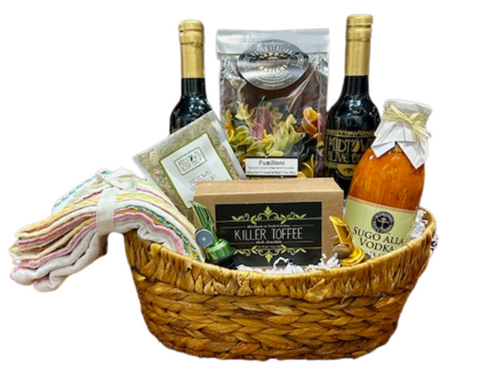 This basket will say "Welcome Home" to any lucky recipient! It comes with a bottle of our best selling Extra Virgin Olive Oil and Aged Balsamic Vinegar, two self-closing pour spouts, Cassina Rossa Imported Sugo Alla Vodka Sauce, Sapori Antichi mulitcolor Fusilloni pasta, Set of 4 Cotton Striped Napkins, a box of dark chocolate Killer Toffee and Midtown's private label Bread Dip; comes in a oval hyacinth basket secured in cello with ribbon.